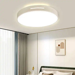 Lámpara de techo LED circular Aura de diseño moderno instalada en dormitorio