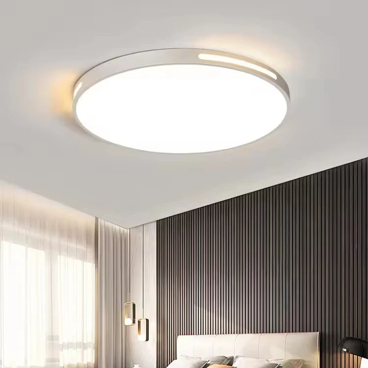 Lámpara de techo LED circular Aura de diseño moderno instalada en dormitorio contemporáneo